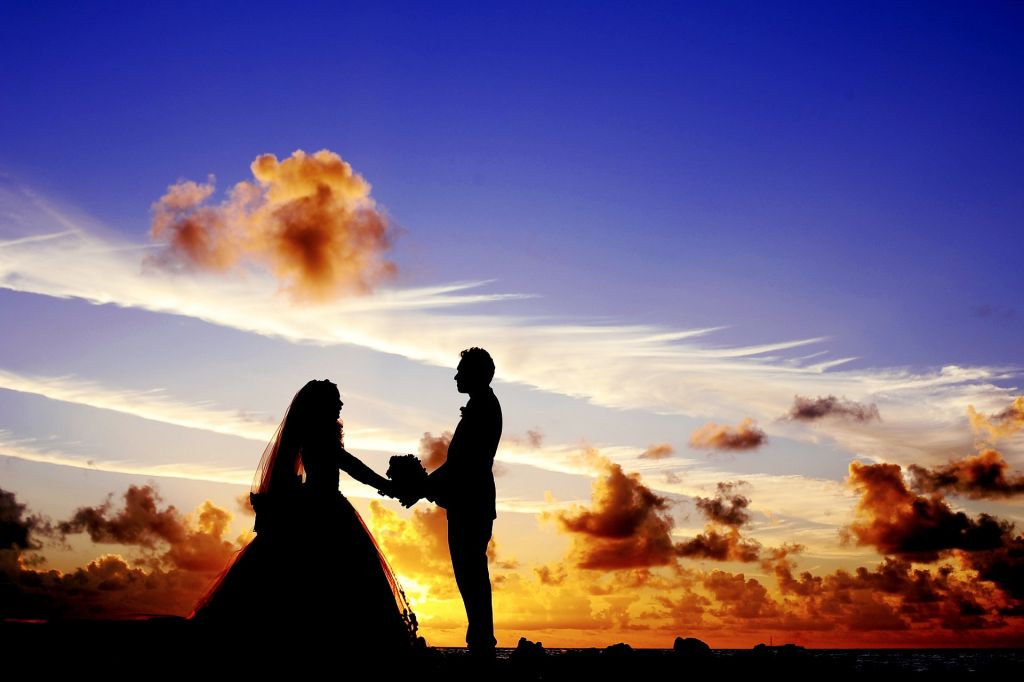 Married Couple enjoying a stunning sunset beach photoshoot, Fuerteventura Weddings